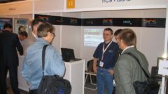 Wojtek Wisniewski at RCS Poland booth with RCS customers.